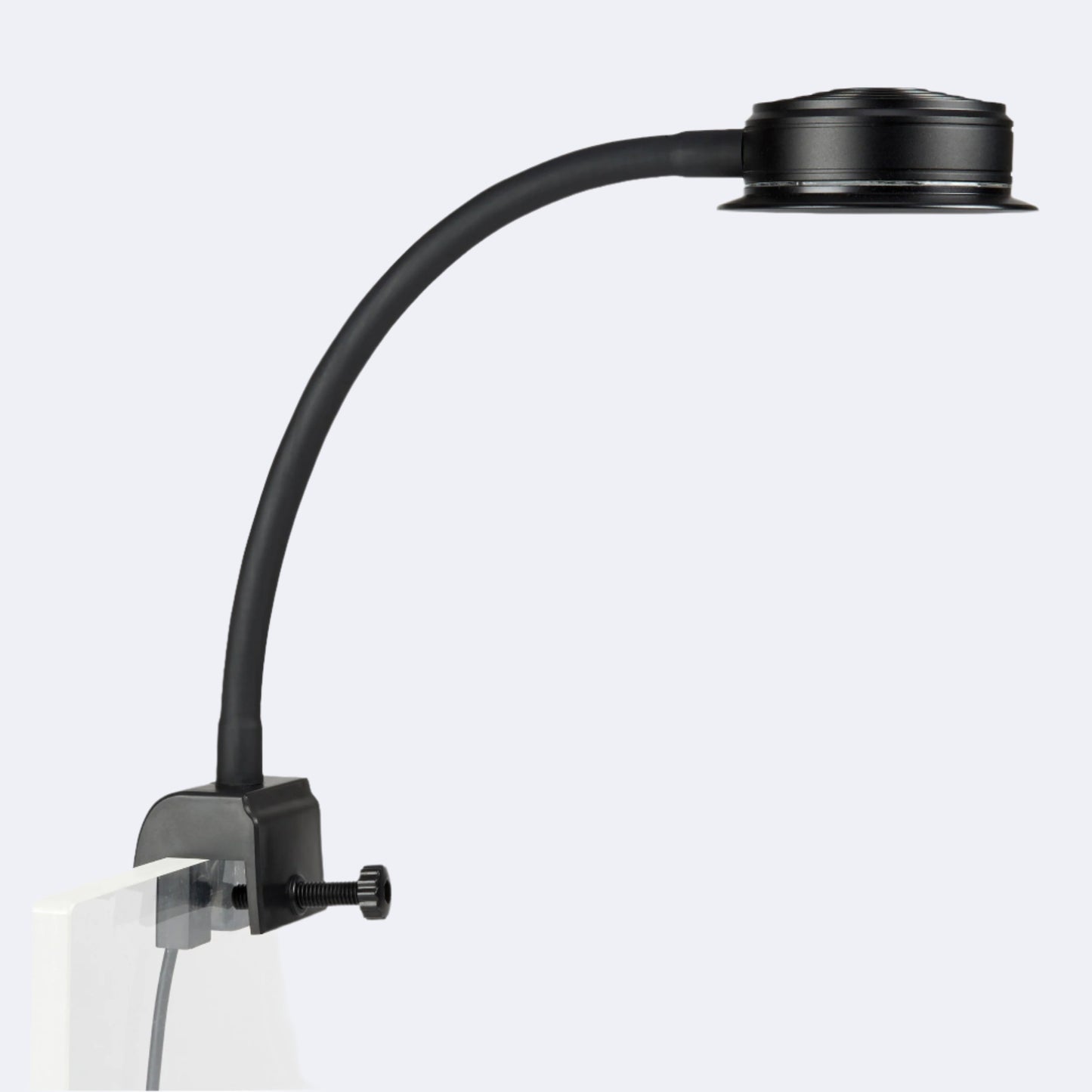 side angle of a reefbreeders pico LED mounted to a rimless aquarium using the built in tank mount.