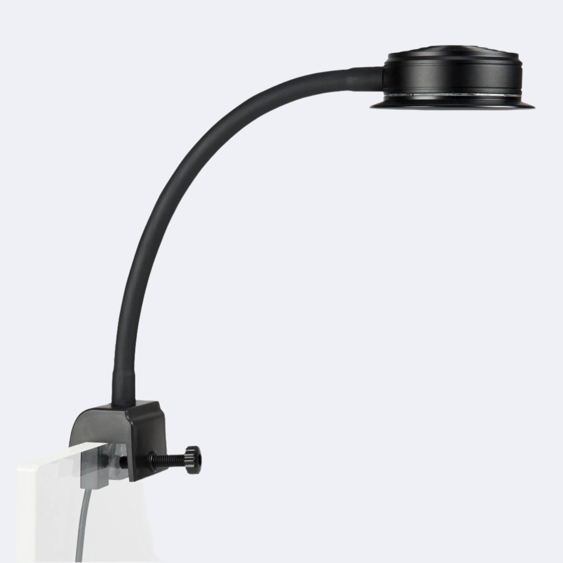 side angle of a reefbreeders pico LED mounted to a rimless aquarium using the built in tank mount.