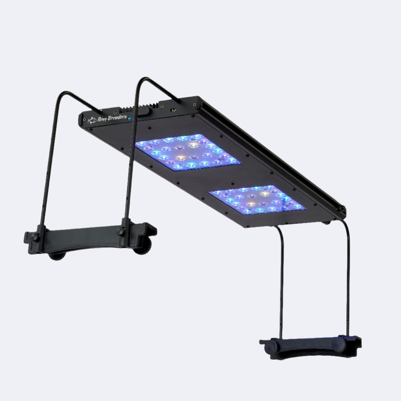 A Meridian 24 running over an aquarium on side of tank mounts, seen from below at an angle with all LEDs on.