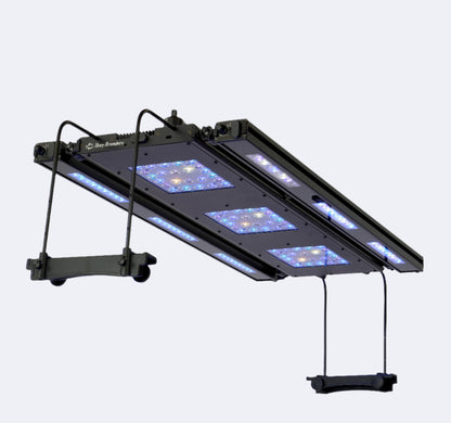 Meridian 35 LED light suspended with side mounting legs, showing 2 edge bars attached pointed straight down. Optional manual controller on top of light. 